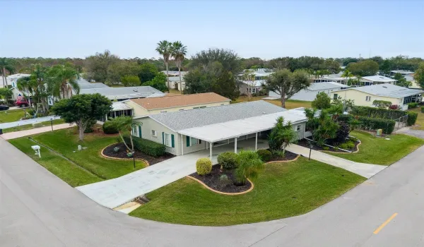 Beautiful corner lot with double driveways and double storage sheds!