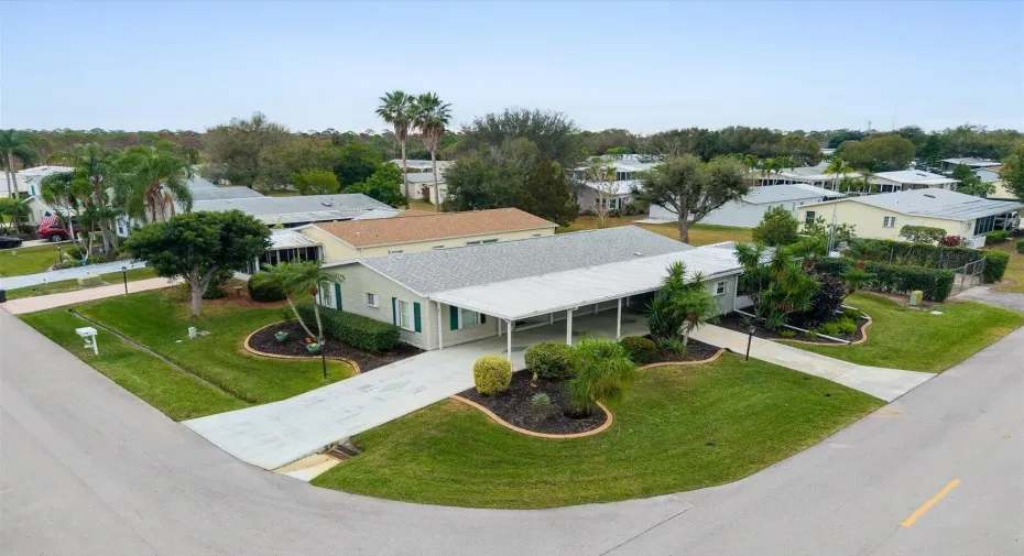 Beautiful corner lot with double driveways and double storage sheds!