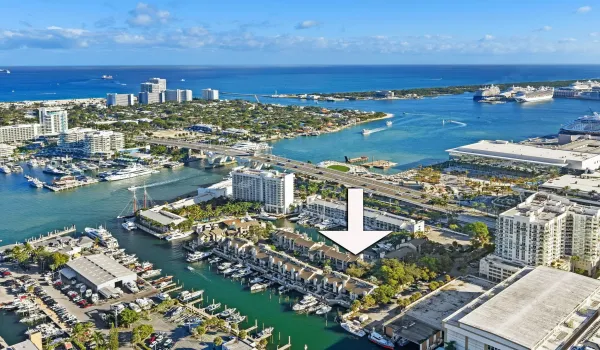 AERIAL VIEW OF PORTSIDE YACHT CLUB SHOWCASING 8 PORTSIDE DRIVE'S PREMIER HARBOR-BASIN LOCATION, MOMENTS TO THE INTRACOASTAL, OCEAN INLET, HILTON MARINA, AND PORT EVERGLADES.