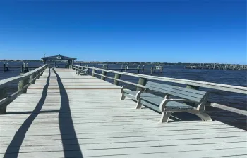 Private pier for the condo community. Perfect for watching the sunrise/ sunset, dolphins, fishing or cocktails with your friends and neighbors!