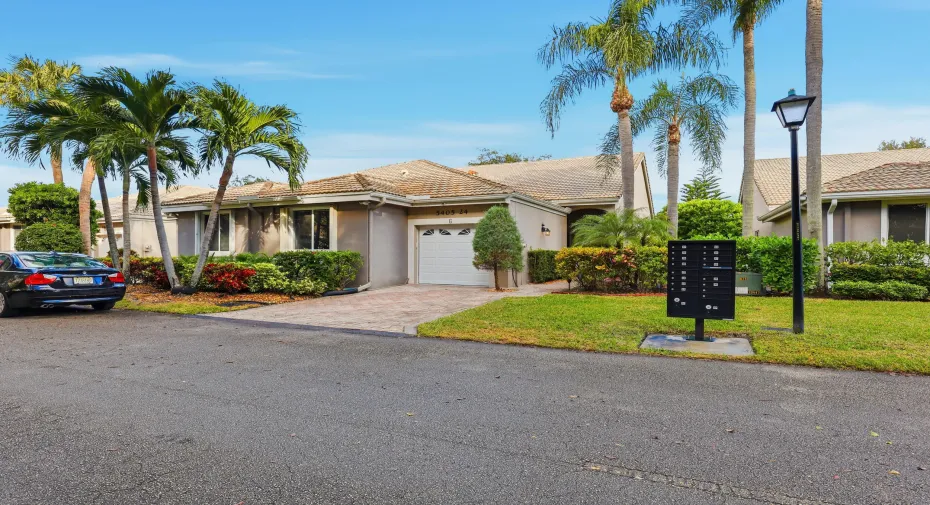 Charming villa with lush tropical landscaping and a welcoming approach. The paver driveway, one car garage, and private entry create great curb appeal while reflecting the relaxed South Florida lifestyle in this beautifully maintained community.