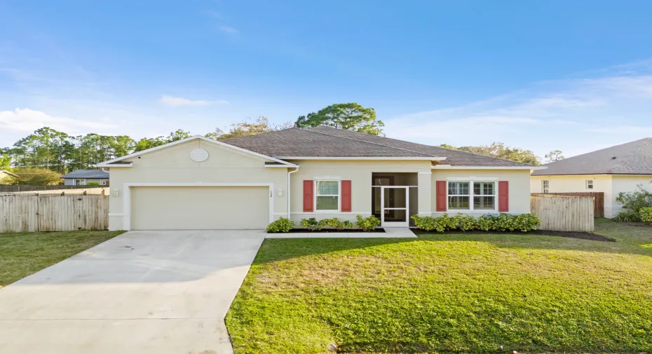 Attractive front elevation with screened entry and charming exterior accents.