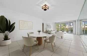Virtually staged Dining/Living with tropical gardens view