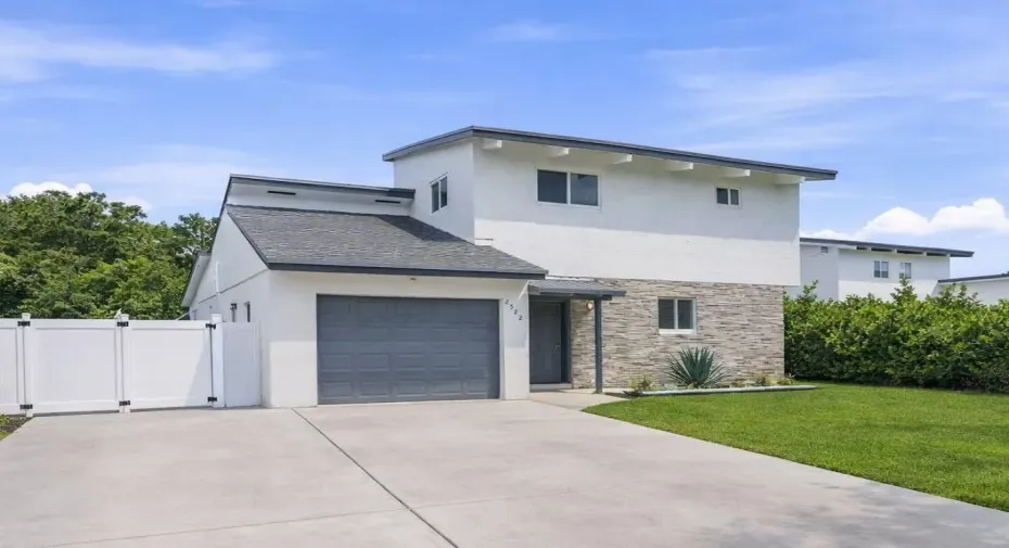 Oversized driveway, with a one car garage but room in the driveway to fit cars side by side.
