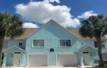 Townhouse on the left includes garages and is located on the second level. Private staircase.
