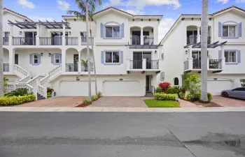 Mediterranean elegance meets modern waterfront living. Perfectly positioned directly on the Intracoastal with a private dock just steps behind the home, this fully renovated townhouse offers effortless access to the Boynton Inlet and is just five minutes from vibrant downtown Delray Beach. Impact windows, a two-car garage, whole-house water filtration system, automatic blinds, and a private waterfront patio reflect the thoughtful detail poured into every inch — no detail has been overlooked.