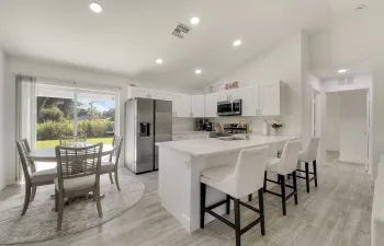 Welcome to the heart of the home — a comfortable kitchen and dining area made for gathering with the people who matter most.