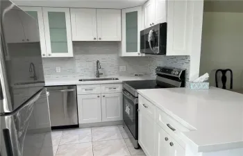 beautifully open, updated kitchen with stainless appliances
