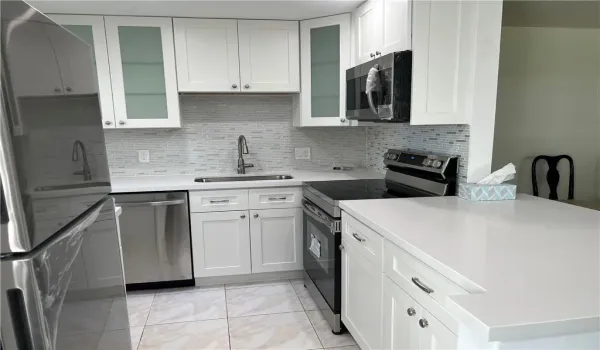 beautifully open, updated kitchen with stainless appliances