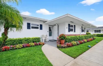 Attractive curb appeal with vibrant surroundings and welcoming charm.