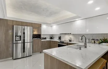 Plenty of counter space with a large island. Recessed lighting and tray ceiling.