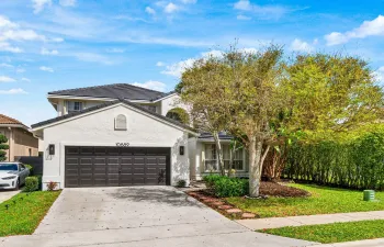 Front of 10889 Tamoron Lane, Boca Raton - New Roof, New Gutters, New Exterior & Interior Paint