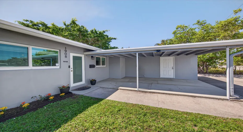 Carport for one car with door for inside access to large closet which goes through to interior of home.