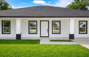 Modern minimalist house with lush lawn