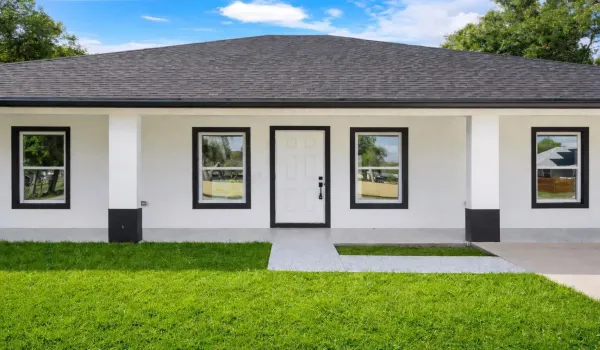 Modern minimalist house with lush lawn