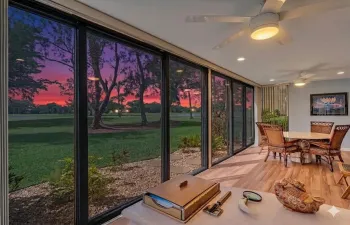 Back closed in patio with gorgeous golf course and sunset views