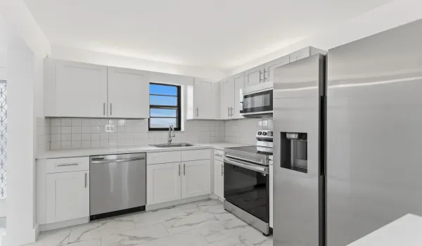 Beautiful Remodeled Kitchen w/shaker style cabinets, stainless steel appliances, luxury vinyl flooring