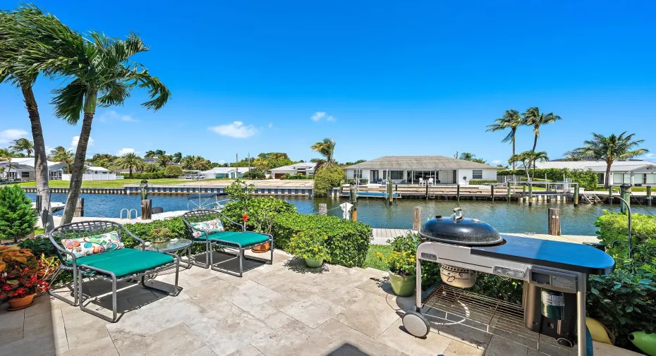 Back patio with panoramic water views steps from freshwater boat slip.