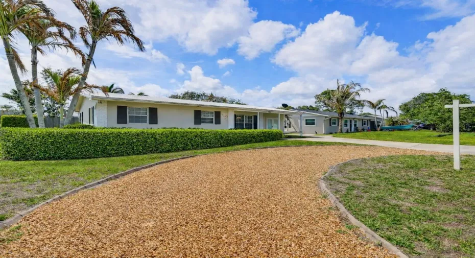 Suburban home with gravel driveway