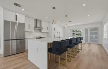 Kitchen, soft close cabinets, Range has combo oven and air fryer, kitchen has commercial vent hood, Dimmable light switches though-out the house, kitchen has microwave drawer, cabinet in island has hidden built in, pullout trash bin, Fridge has built-in auto refill water pitcher