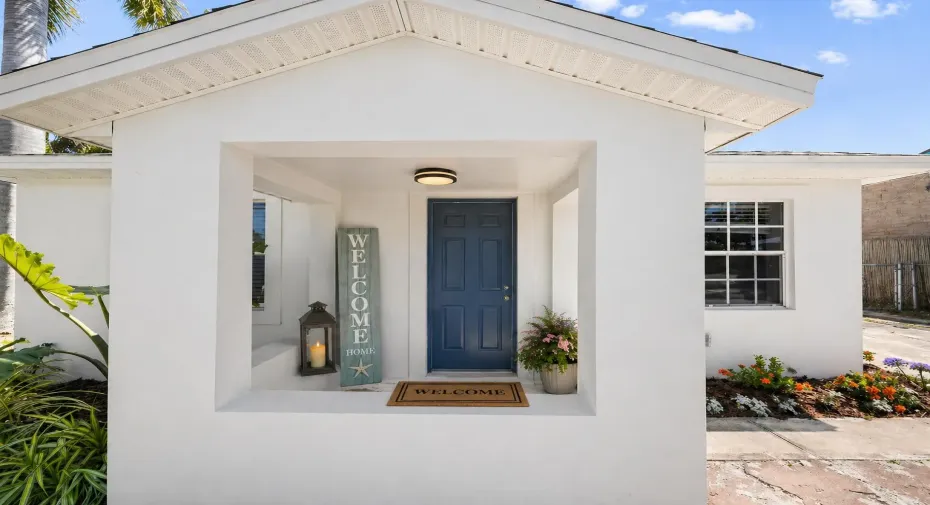 Charming coastal exterior with welcoming entry