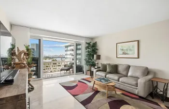 Beautifully renovated unit with marble floors throughout and continuing onto balcony. Sweeping views of the ocean and port through your impact windows.