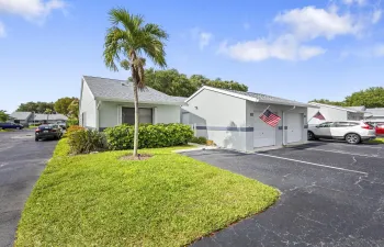 Charming 2/2 villa with a clean, well-maintained exterior, surrounded by lush landscaping and a welcoming approach that sets the tone from the moment you arrive.