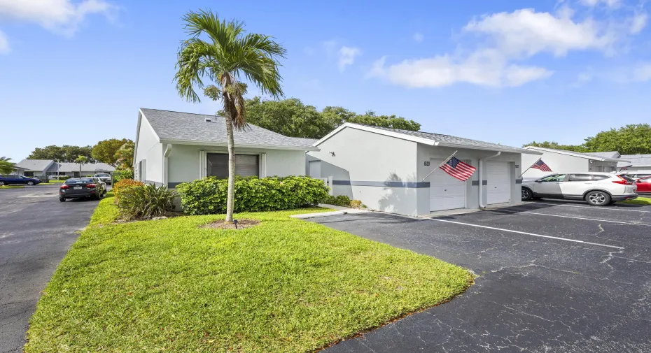 Charming 2/2 villa with a clean, well-maintained exterior, surrounded by lush landscaping and a welcoming approach that sets the tone from the moment you arrive.