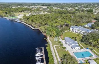 Aerial view of the community pool, boat slips, and nearby The Port District