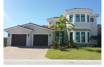Photo is from a previously built Cypress Model Home. New Cypress II has flat roof tile, more open floorplan.