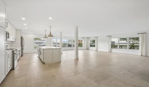 Generous open-concept layout with panoramic water views— 1,835 sq ft of living space provides flexibility for multiple dining, entertaining, or work-from-home configurations.