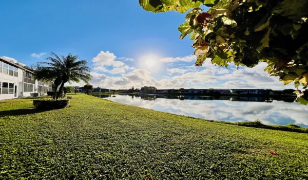 Gorgeous WATER VIEWS! Lovely FIRST FLOOR 2/1.5 Century Village Condo.