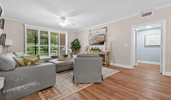 With vinyl plank floors and sliders to the porch + patio