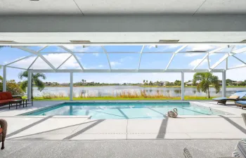 Picturesque lake views thru your heated and screened pool