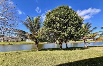 Highly Desirable First Floor 2/1.5 With Water Views and Fantastic Location Close to the Haverhill Entrance and Main Clubhouse!