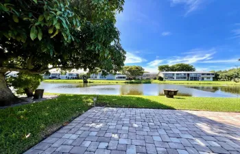 First Floor CORNER 2/1.5 With Pretty Water Views! Fantastic Location Close to Hastings Fitness Center. Photo Is Of The Patio for Sheffield D Residents