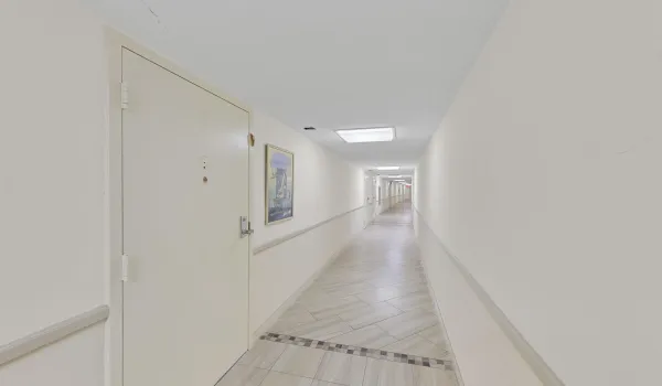 Completely covered entry from the parking garage.