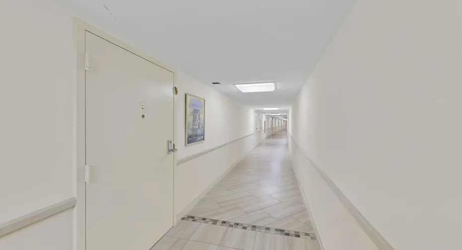 Completely covered entry from the parking garage.