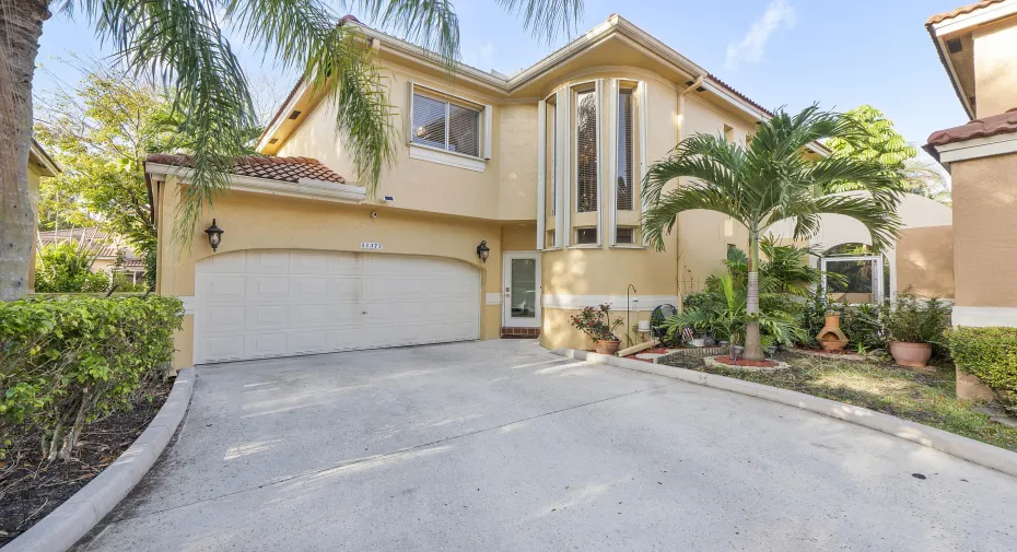 Exterior Front with expansive driveway and 2 car garage