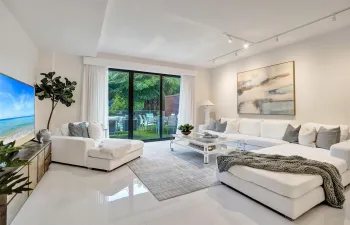 large living space with lush green views