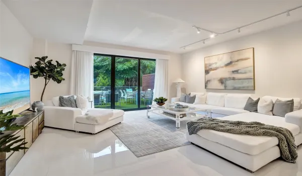 large living space with lush green views