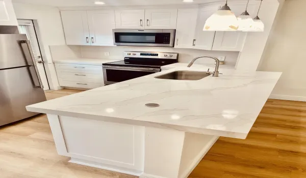 New White Cabinetry and Eat-in Breakfast Counter