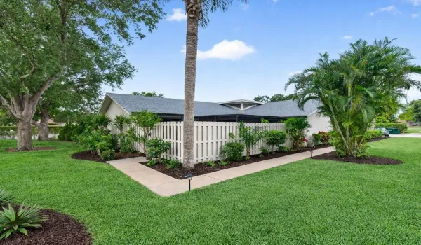 Suburban home with tropical landscaping