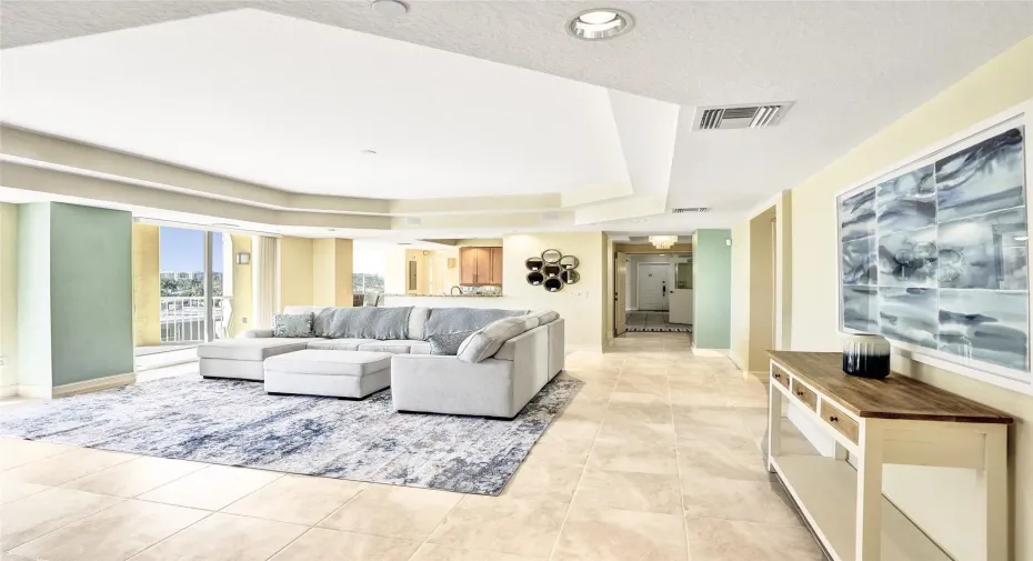 spacious living room with high ceilings and lots of light