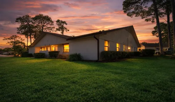 Completely remodeled 2BR/2BA CBS villa in a gated community offering comfort, style, and low-maintenance living. This move-in-ready home features tile flooring throughout, updated finishes, and bright open living spaces. Solid CBS block construction provides durability and peace of mind. Includes a single-car carport and convenient access to community amenities including a pool, pickleball, tennis, and racquetball courts. Ideal for seasonal or year-round living. Some photos have been virtually staged for illustration purposes.