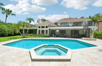 Expansive home with 2 screened lanais and open upper deck and all with golf course views