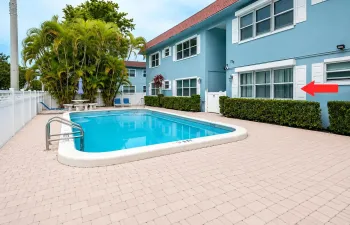 First floor corner unit with pool view