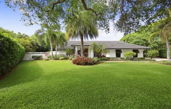 Welcome home to this beautifully updated ranch style home featuring lush tropical landscaping, an expansive front lawn, and striking curb appeal in the extremely desirable Verona Woods community.