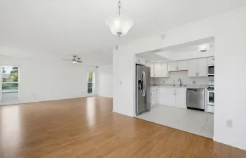 Newer soft-close white cabinets, countertops, appliances, lighting and tile!