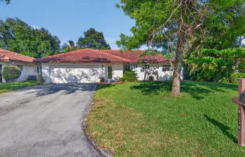 Excellent location in the community! Sprawling open grass space, mature trees and large driveway.